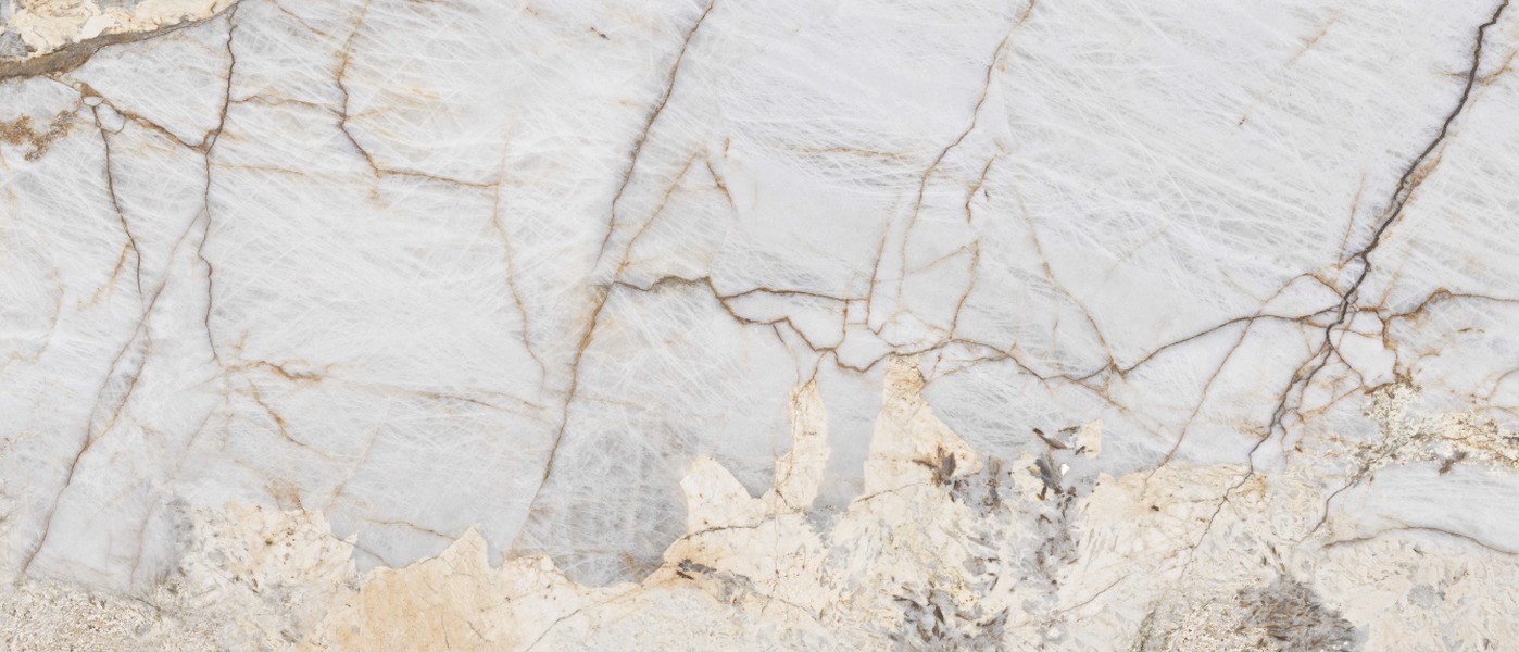 Patagonia Bianco porcelain slab surface, a white field with grey and brown-gold veining